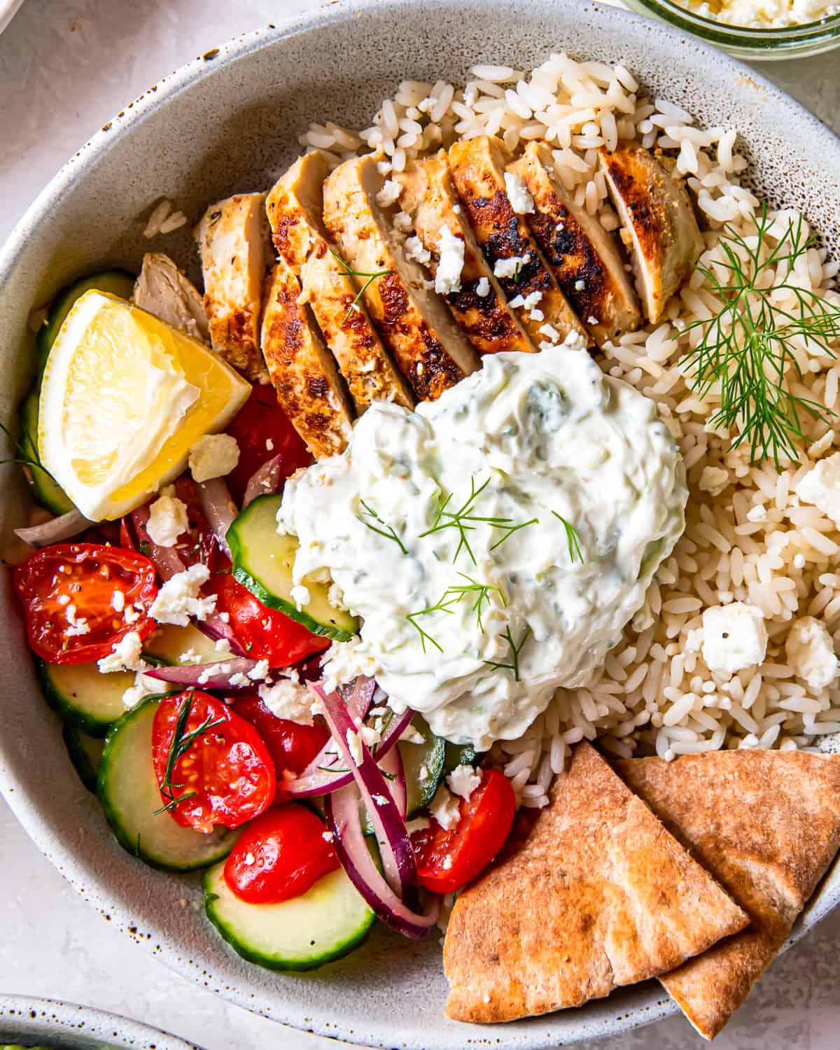 close up overhead view of a chicken tzatziki bowl.