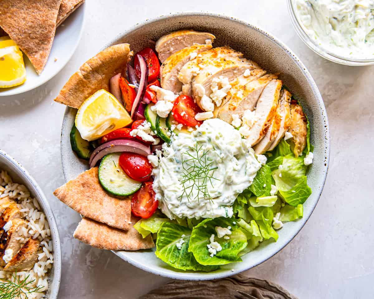 overhead view of a chicken tzatziki bowl with lettuce instead of rice.