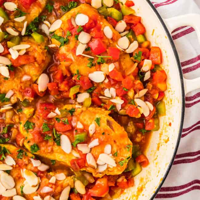 partial overhead view of country captain chicken in a pan.