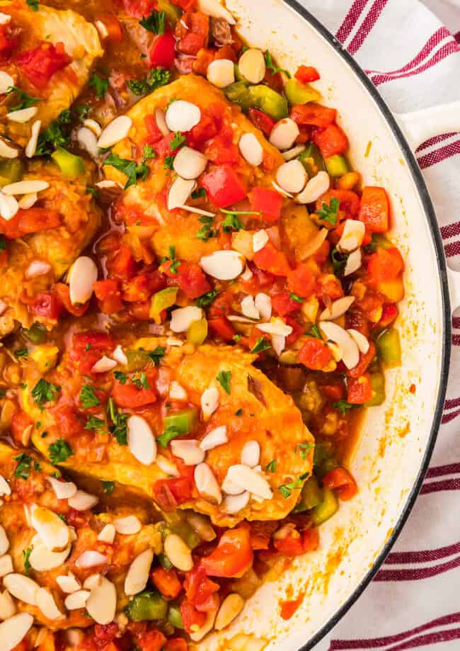 partial overhead view of country captain chicken in a pan.