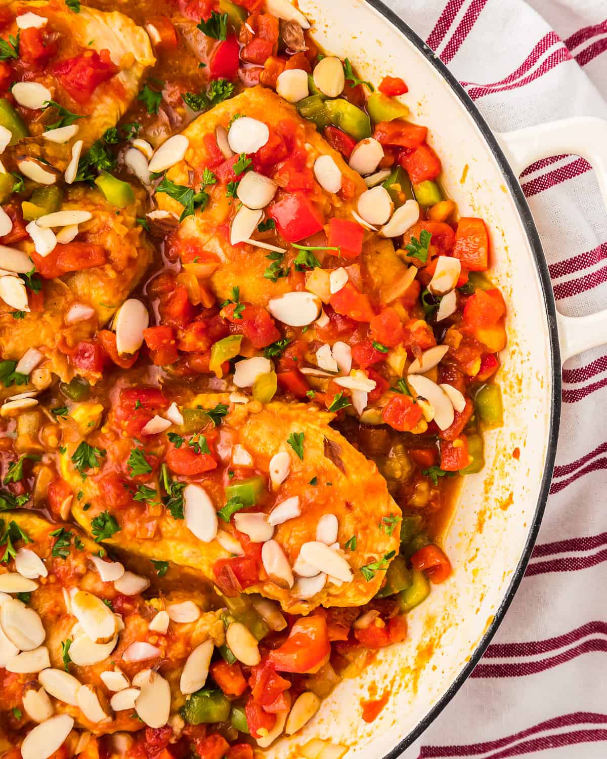 partial overhead view of country captain chicken in a pan.