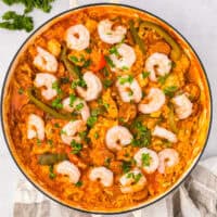 overhead view of chicken paella in a pan.