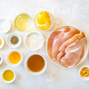 overhead view of ingredients for chicken francese in individual bowls.