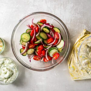 tossed chopped veggies in a glass bowl.