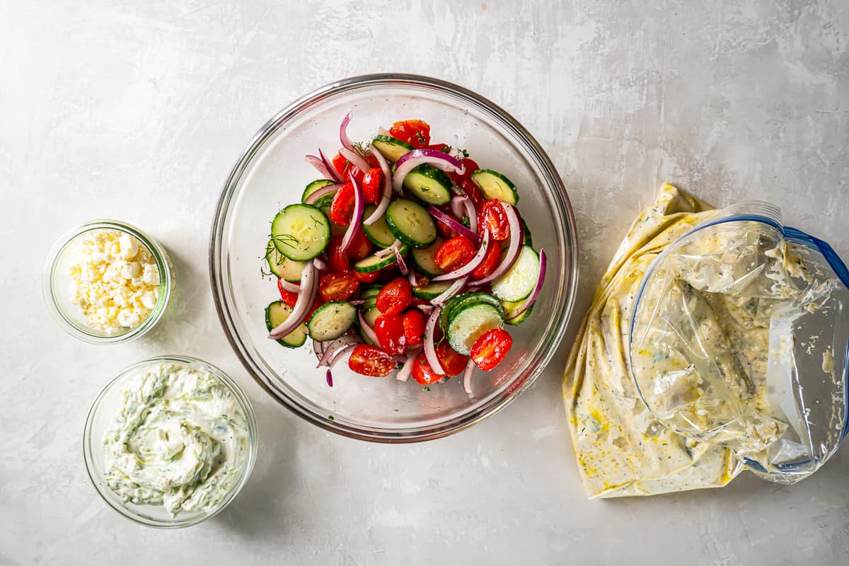 tossed chopped veggies in a glass bowl.