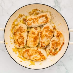 cooked chicken breasts in a pan.