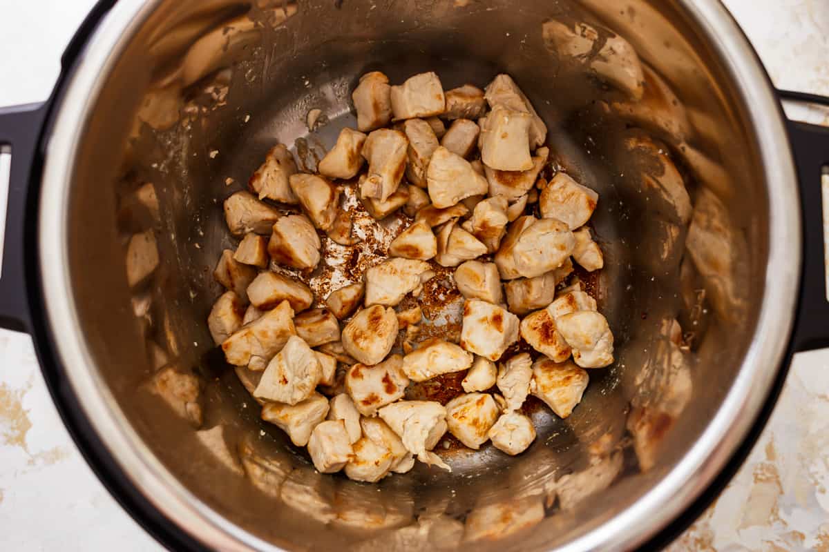 cooked cubed chicken in an instant pot.