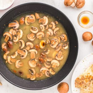 saucy mushrooms in a skillet.