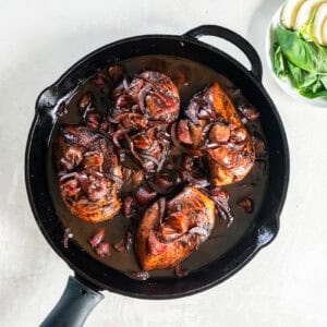 cooked down strawberry balsamic chicken in a pan.