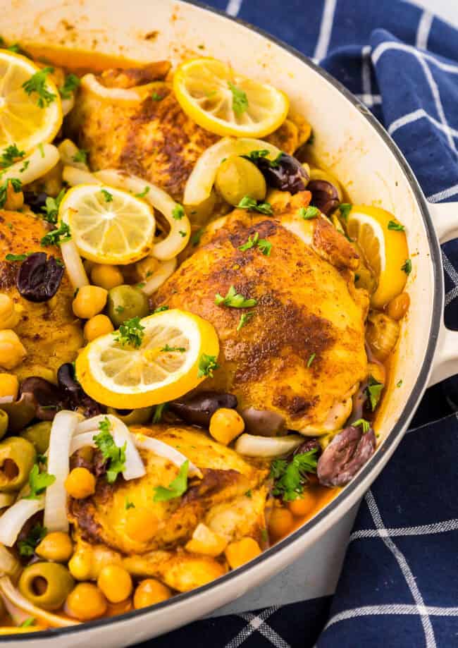 partial view of moroccan chicken thighs in a pot.