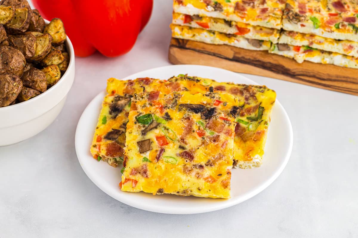 sheet pan eggs on a white plate.