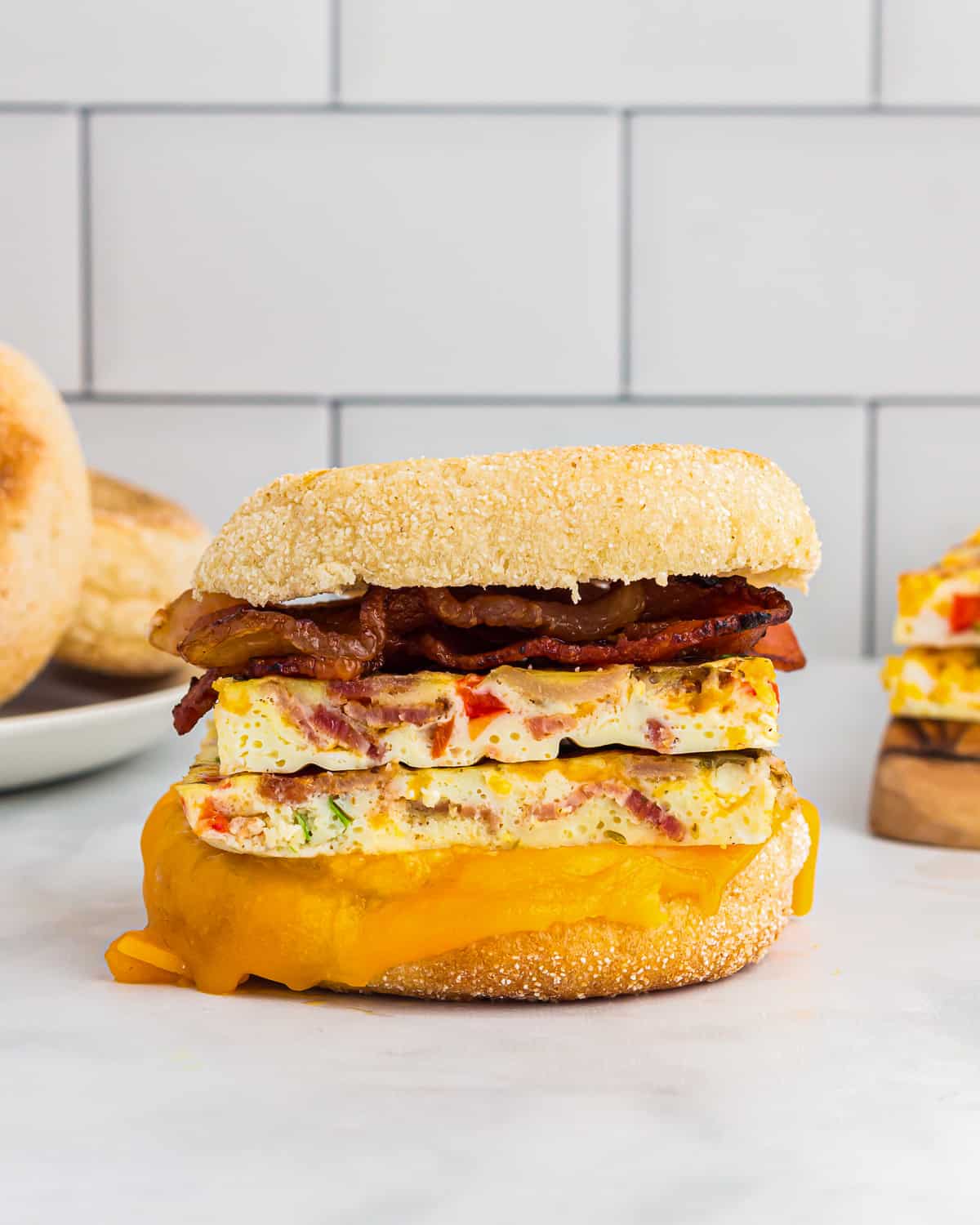 side view of 2 sheet pan eggs on an egg sandwich.