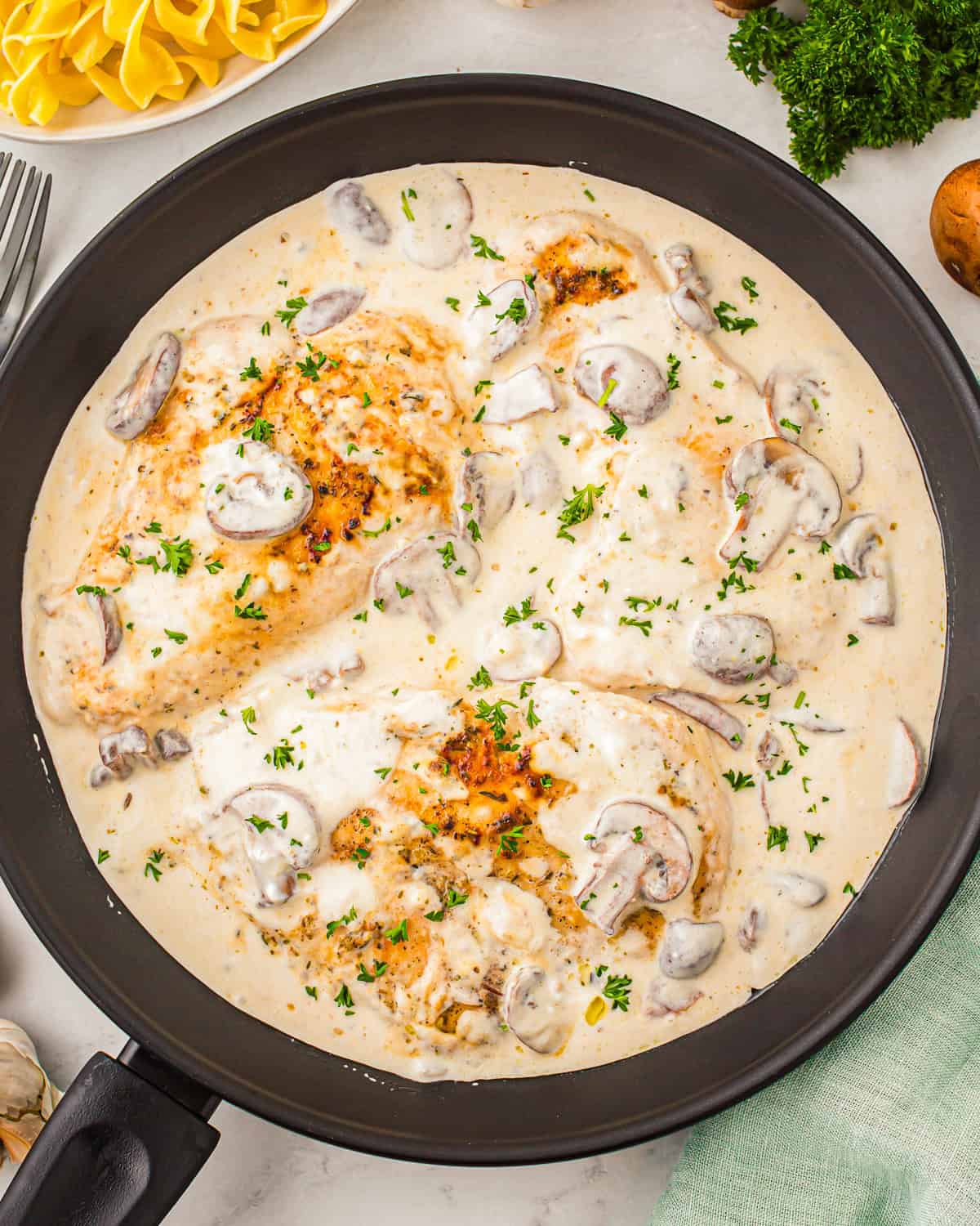 overhead view of sour cream chicken in a skillet.