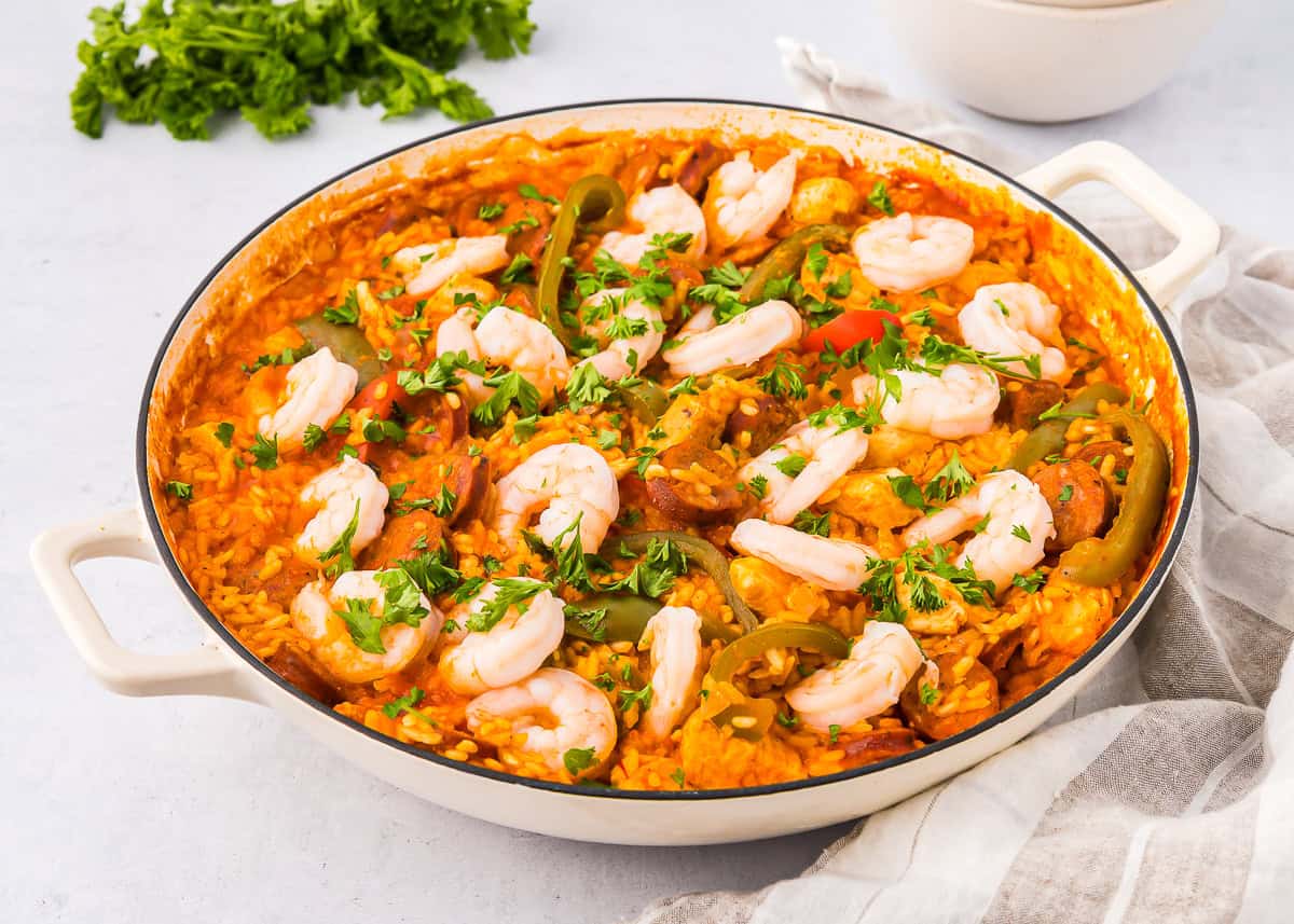 three-quarters view of a pan of chicken paella.