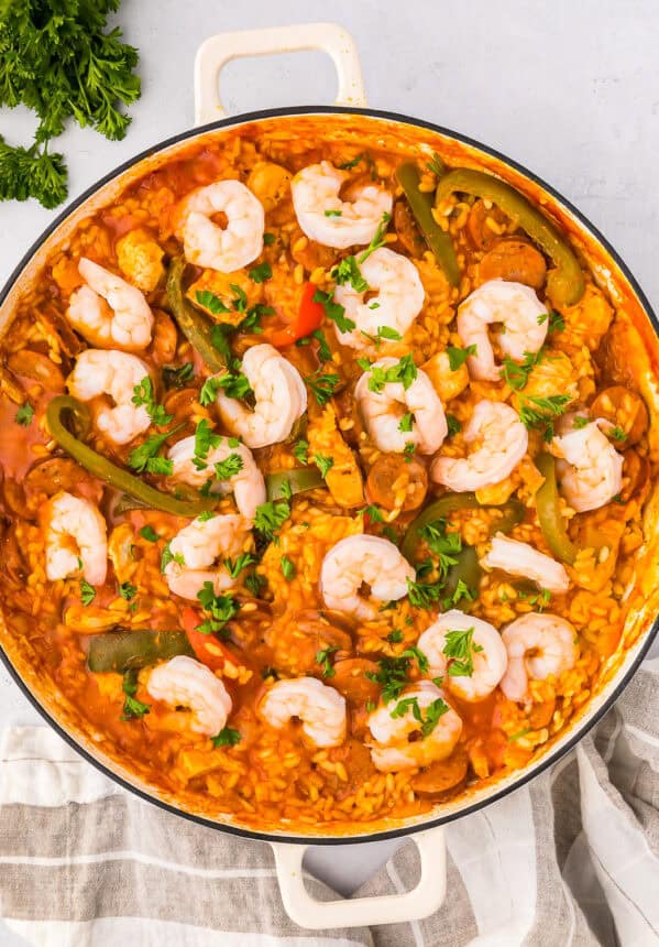 overhead view of chicken paella in a pan.