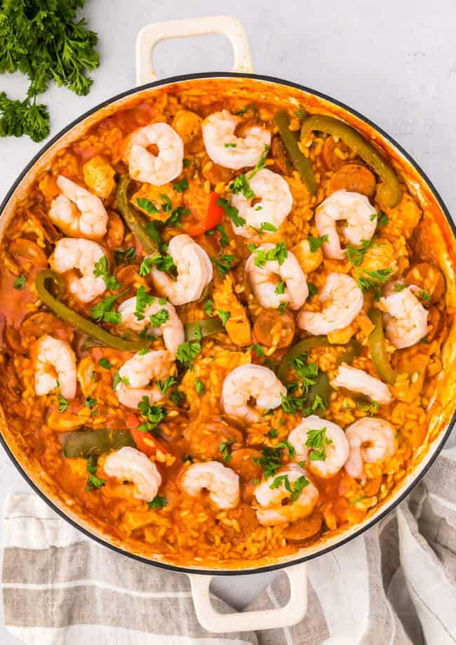 overhead view of chicken paella in a pan.