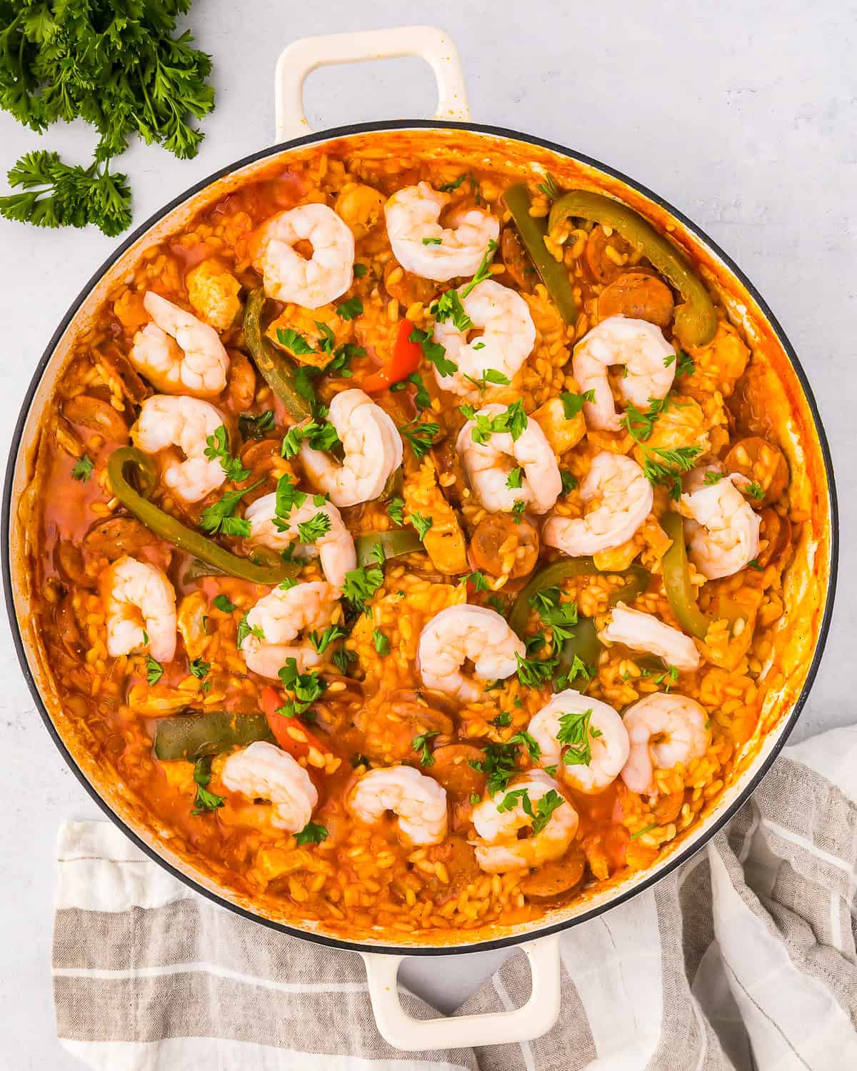 overhead view of chicken paella in a pan.