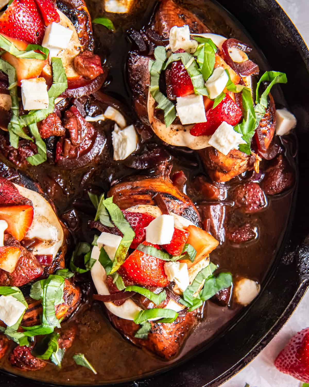 close up overhead view of strawberry balsamic chicken in a pan.