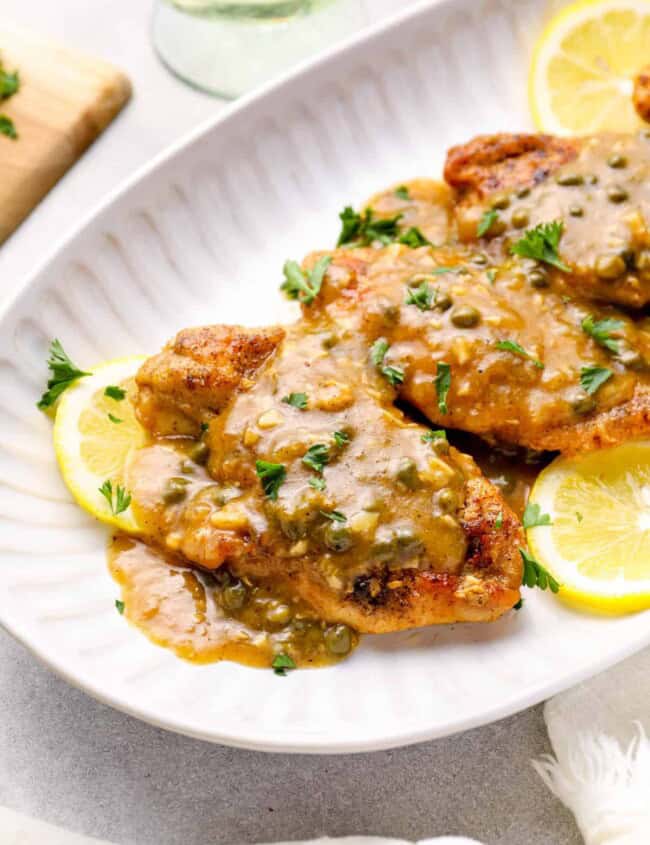 instant pot chicken piccata on a white serving tray.