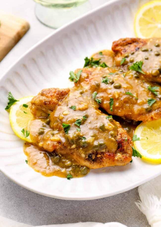 instant pot chicken piccata on a white serving tray.