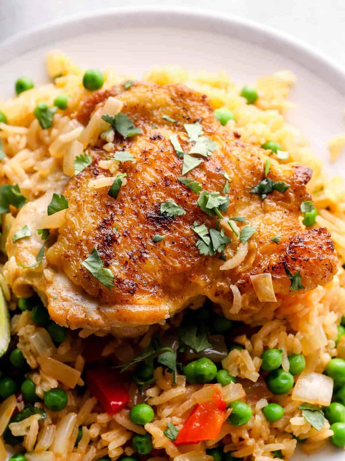 arroz con pollo chicken thigh on plate