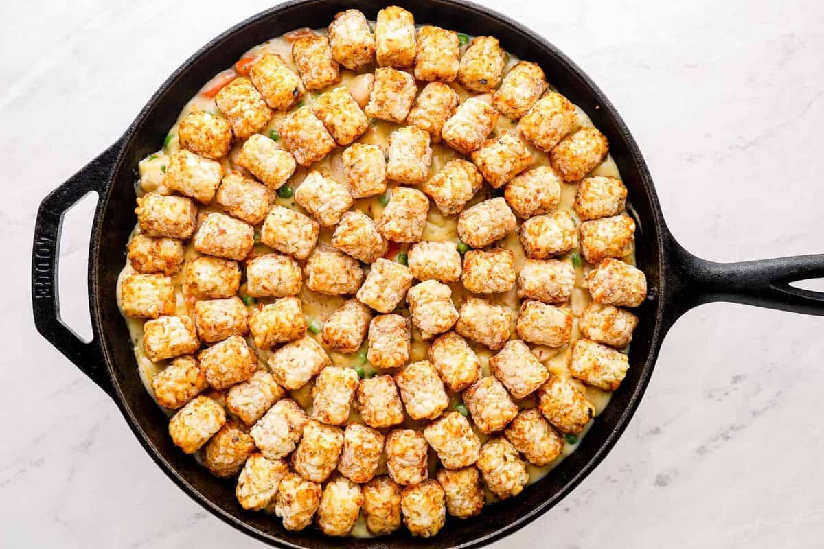 tater tots on top of skillet