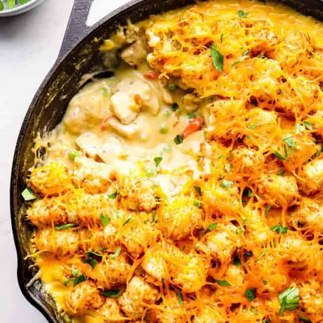 spoonful out of tater tot chicken casserole with cheese