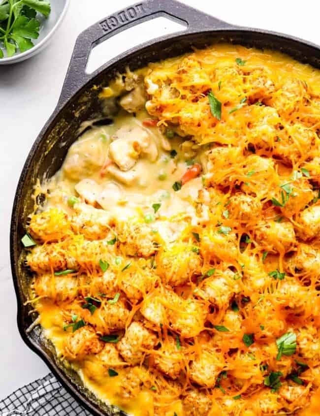 spoonful out of tater tot chicken casserole with cheese