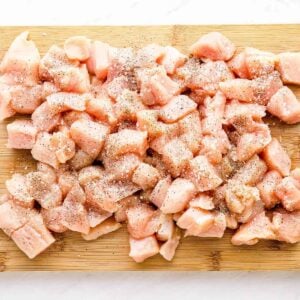 chunks of chicken on cutting board