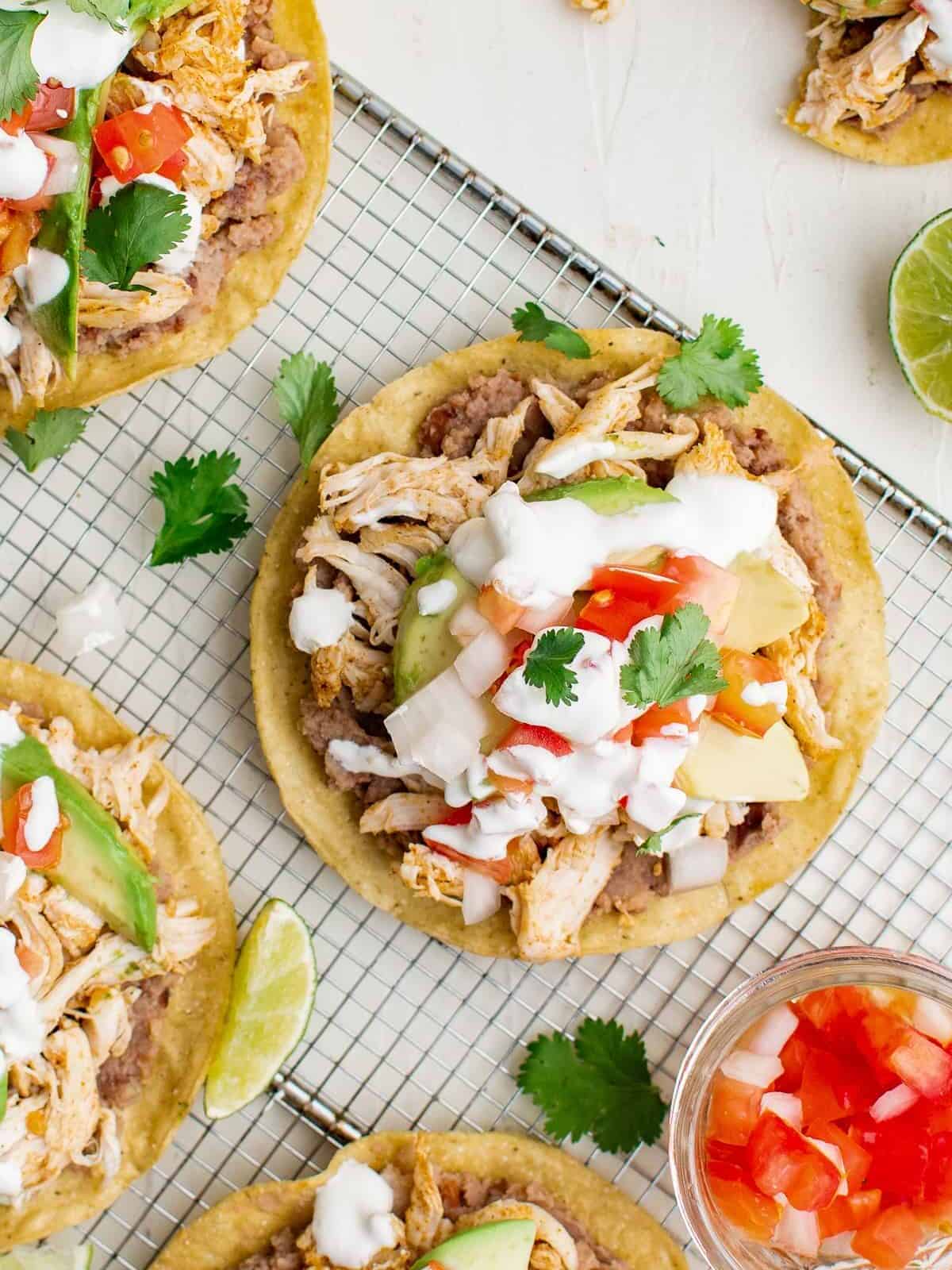 up close overhead image chicken tostadas on cooking rack