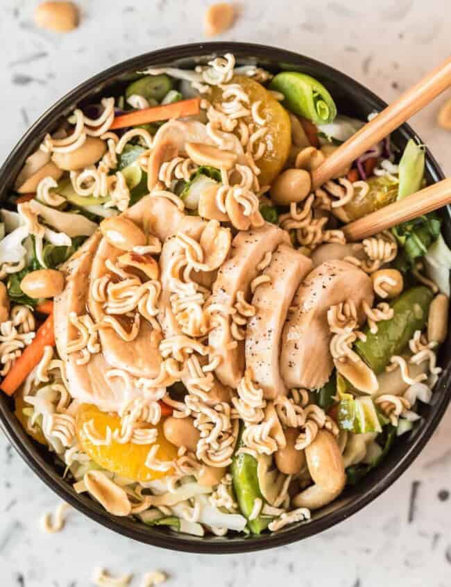 chinese chicken salad in bowl with chopsticks