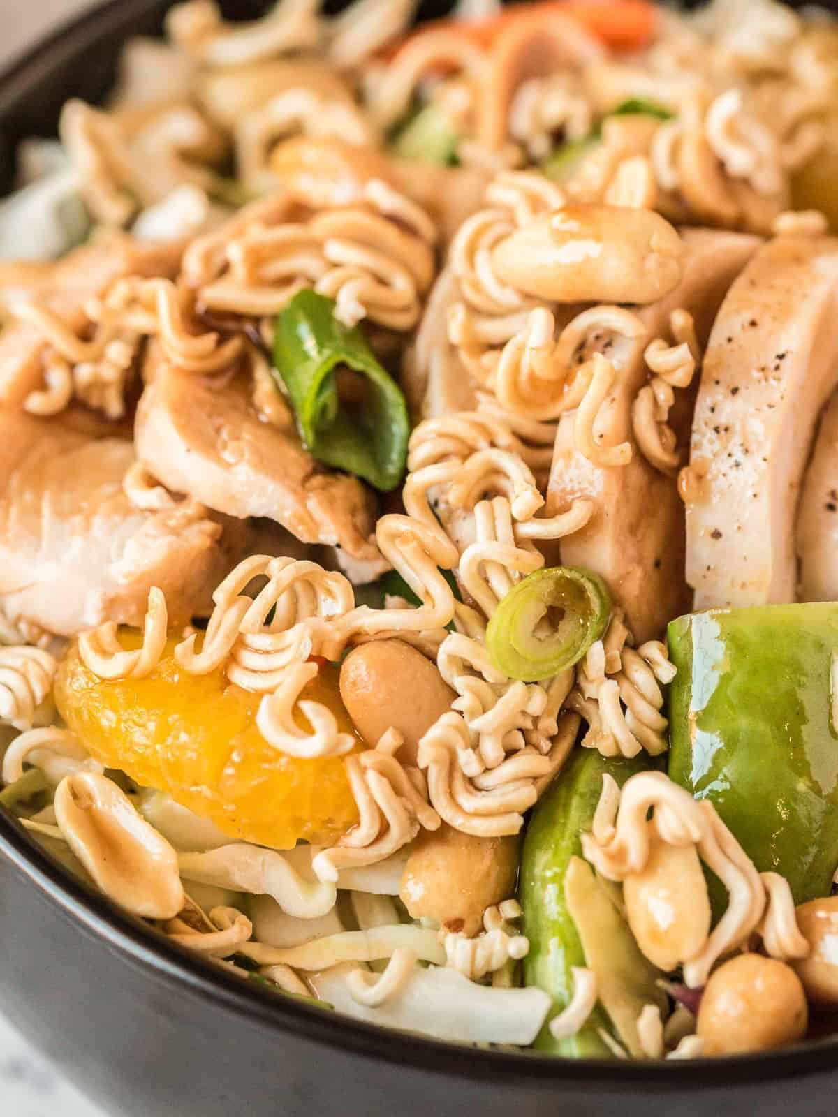 Close up on Chinese chicken salad with peanut dressing.