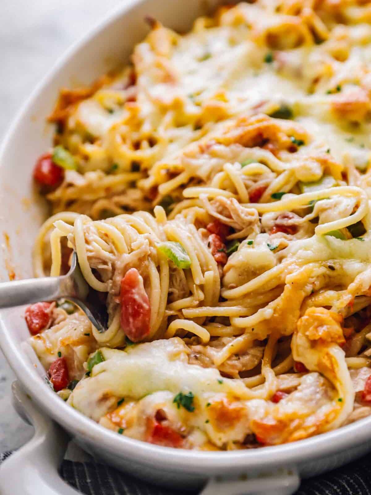 chicken spaghetti casserole filled with bell peppers and cheese
