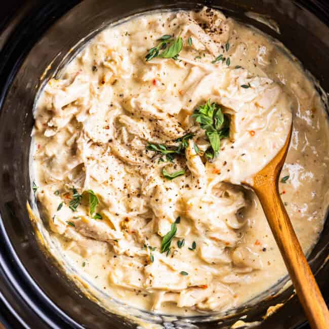 Overhead view of creamy Italian chicken in a Crock Pot.