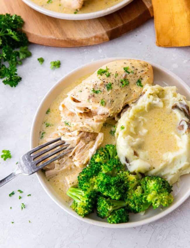 a plate of crockpot ranch chicken dinner on a table