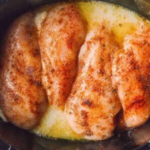 chicken breasts with seasonings in slow cooker