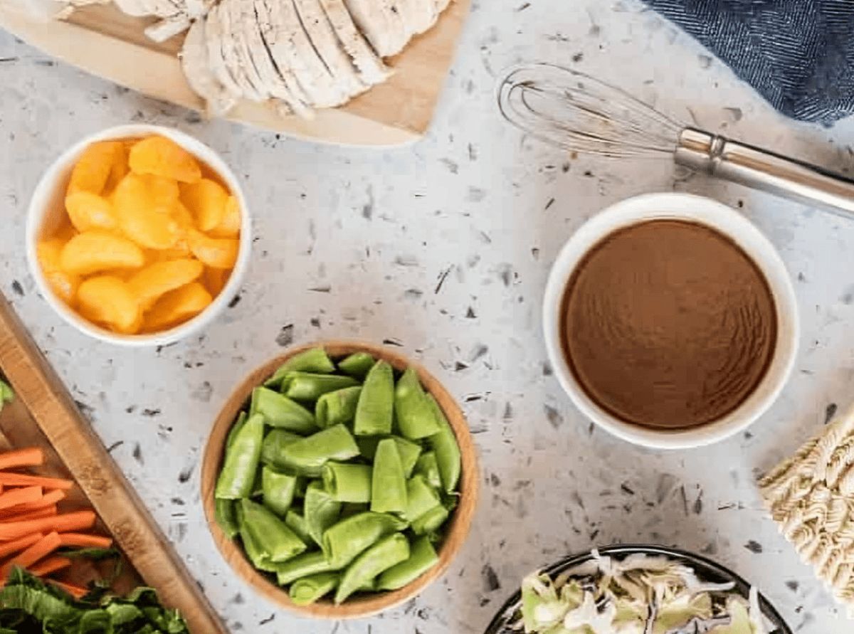 chinese chicken salad dressing in a white bowl.