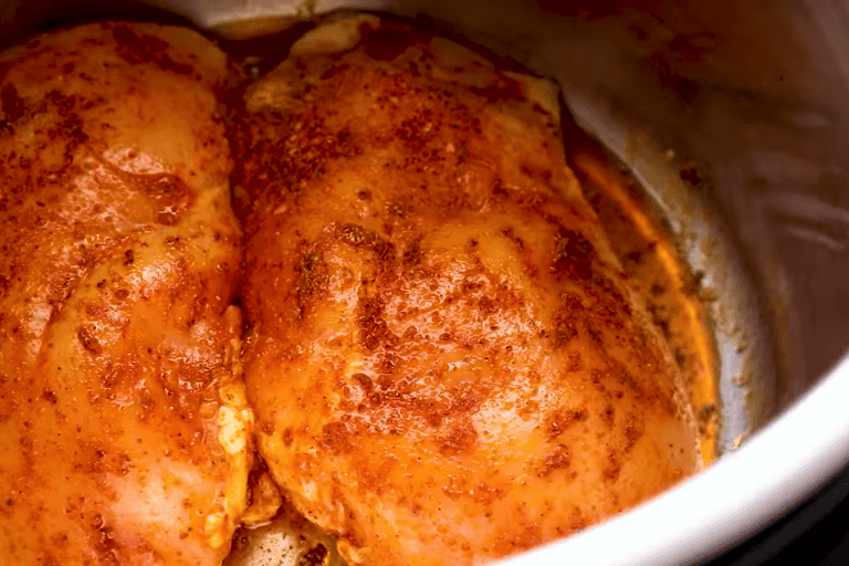 Chicken breasts browning in an Instant Pot.