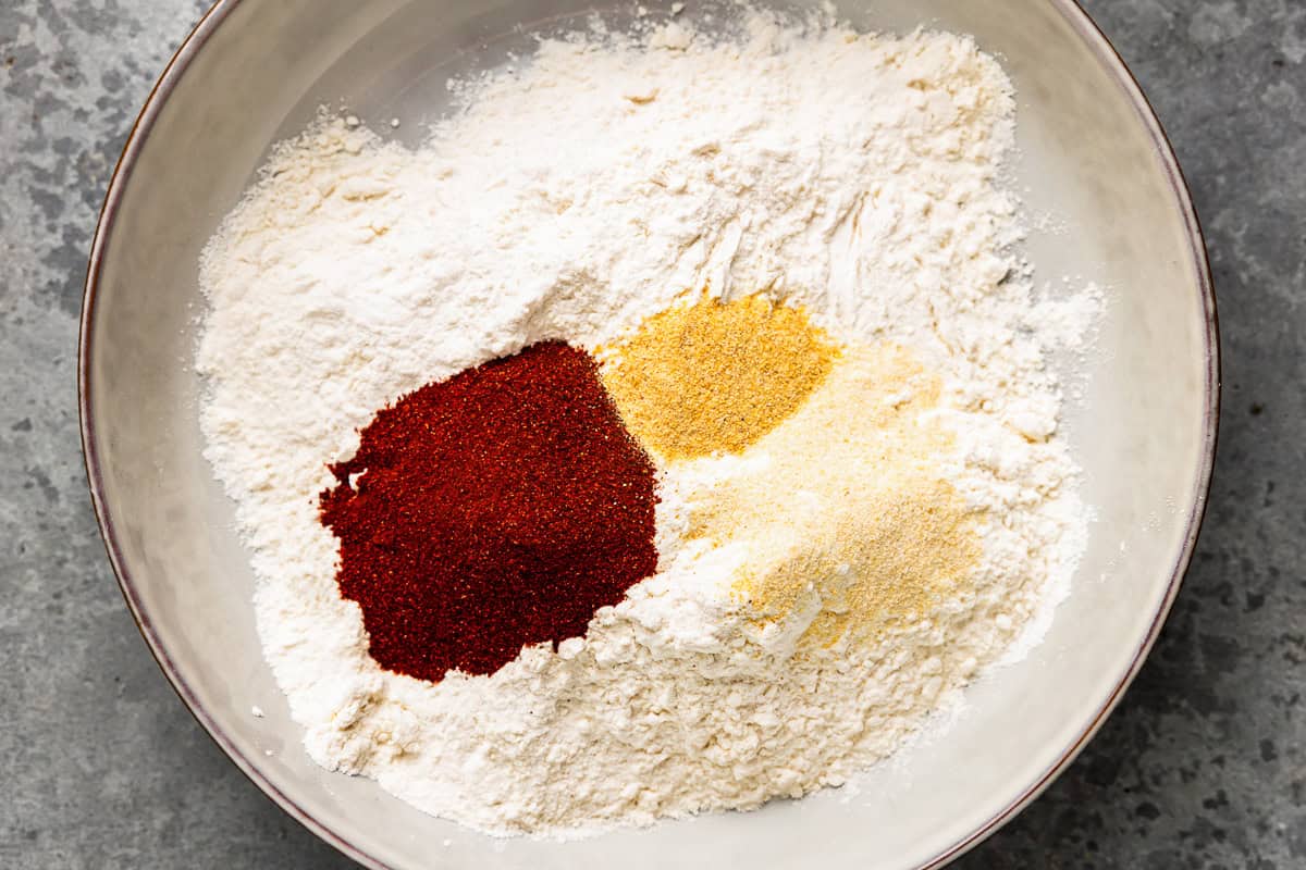 A mix of flour and spices in a shallow dish.