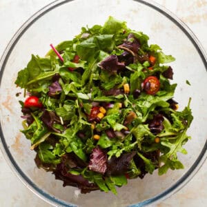 salad greens in a glass bowl.