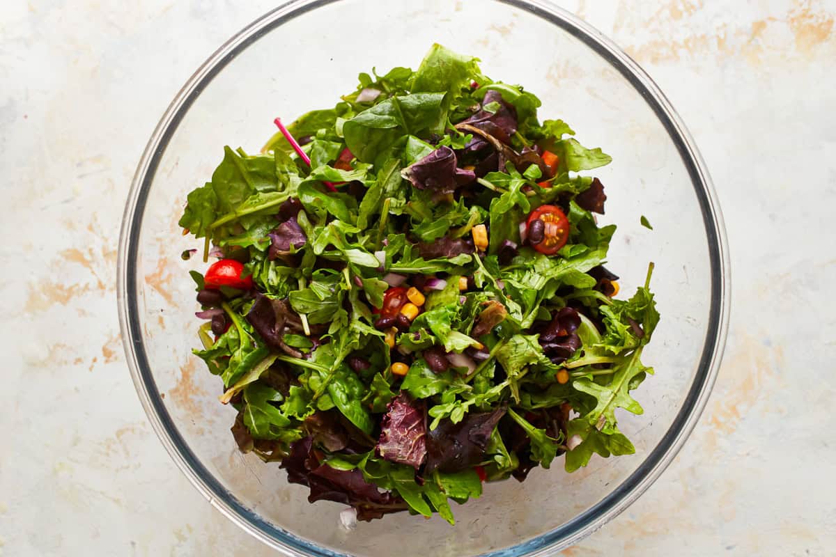 salad greens in a glass bowl.