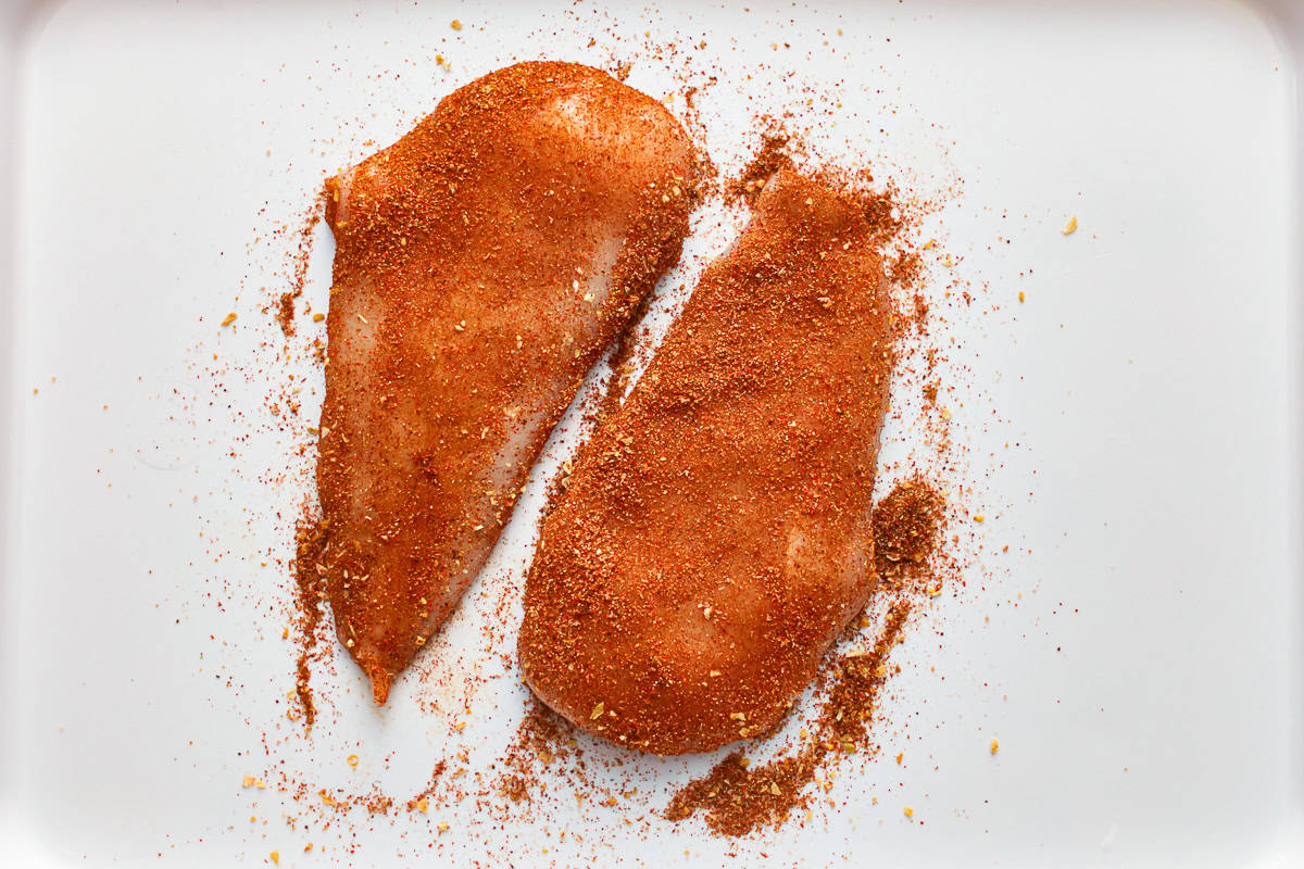 seasoned raw chicken breasts.