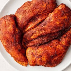 bbq seasoned chicken breasts on plate