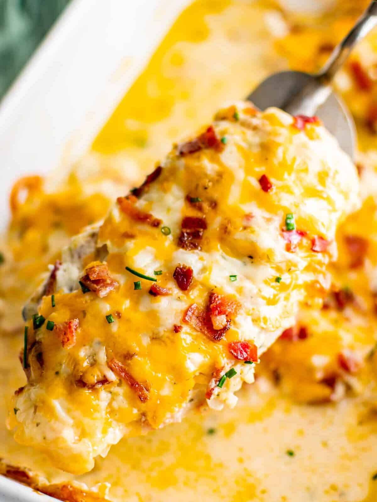 lifting up ranch chicken with bacon