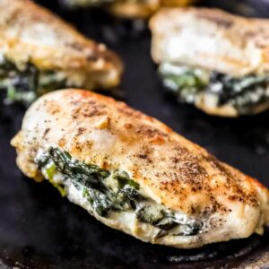 4 stuffed chicken breasts in a skillet