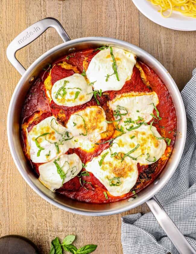 stuffed chicken parmesan in a skillet.