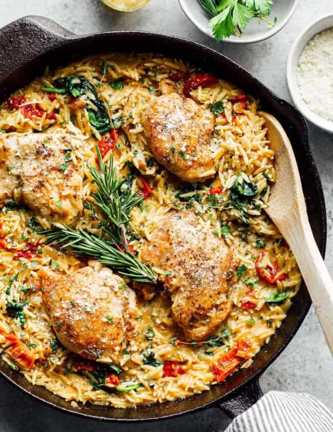 tuscan chicken or orzo in black skillet