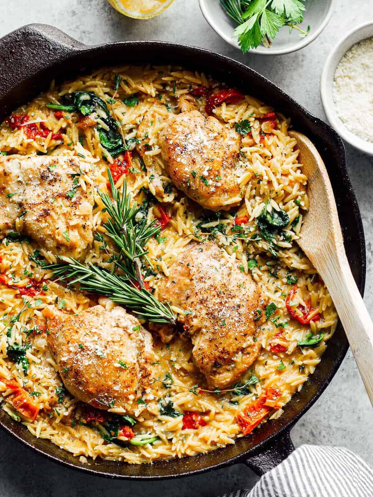 tuscan chicken or orzo in black skillet