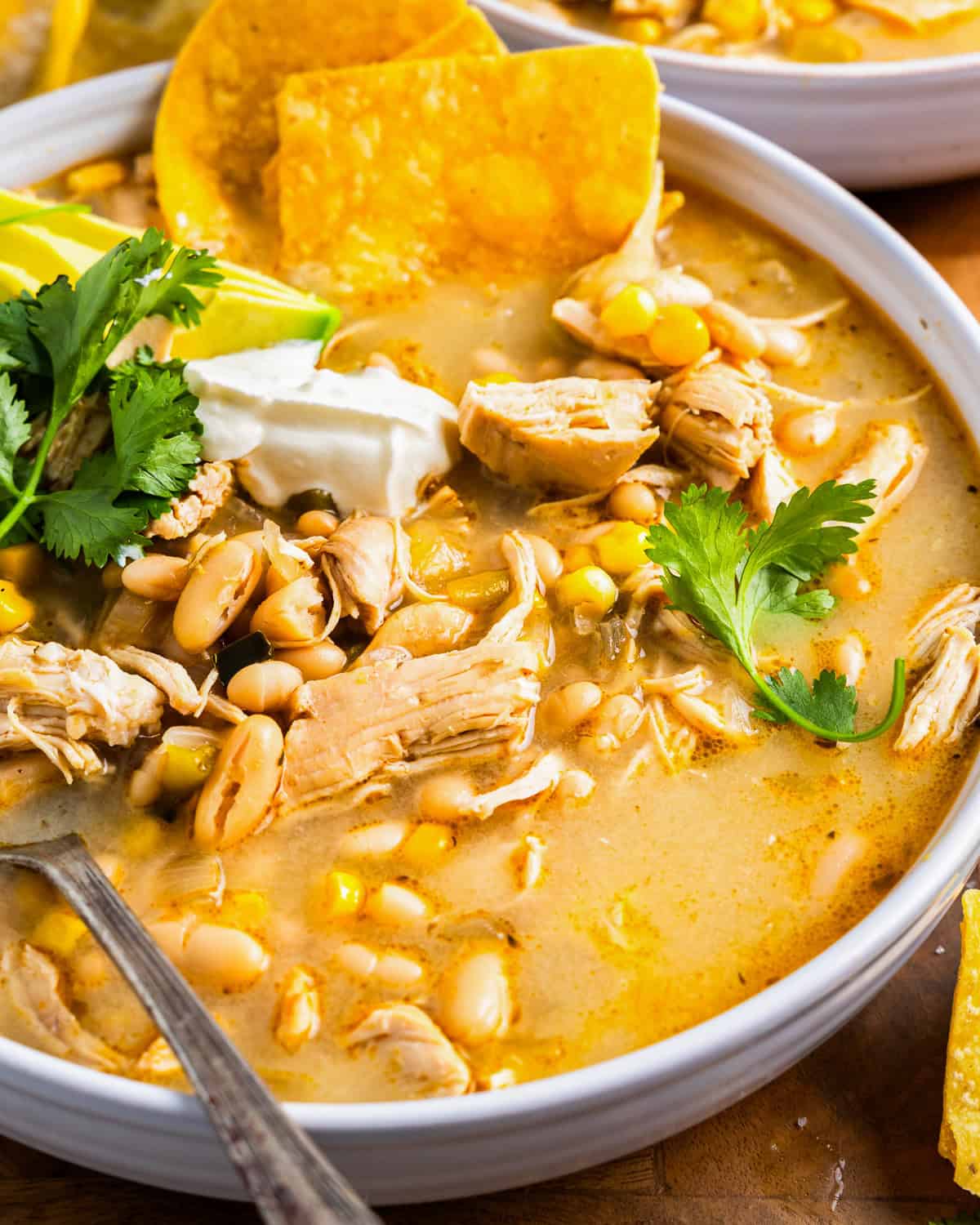 A bowl of white chili with chicken.