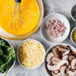 mushroom frittata ingredients arranged in bowls